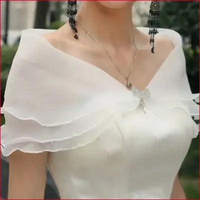 Elegant white bridal shawl with ruffles and removable shoulder straps for wedding parties