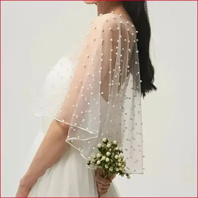Pearl-dotted sheer bridal cape with wedding dress lace and pearl short cape design