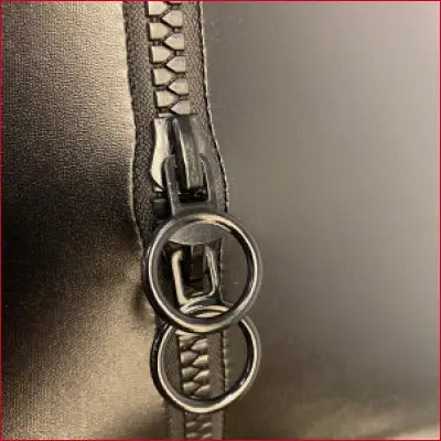 Metal zipper with circular pull tab on Black Faux Leather Handmade Leggings with Crotch Zipper Triangle Design