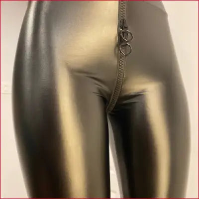 Shiny metallic gold leggings with crotch zipper triangle and black faux leather detail