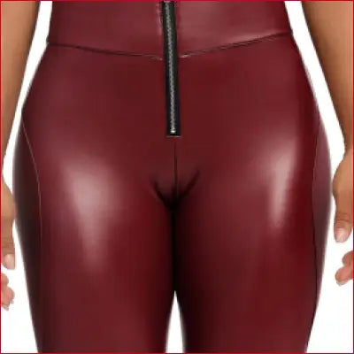 Tight fitting burgundy leather women’s leggings with front zipper for stylish looks