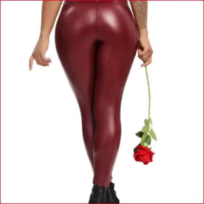 Shiny burgundy leather women’s leggings with front zipper for a tight fitting look