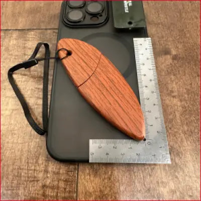 Wooden surfboard-shaped USB drive.