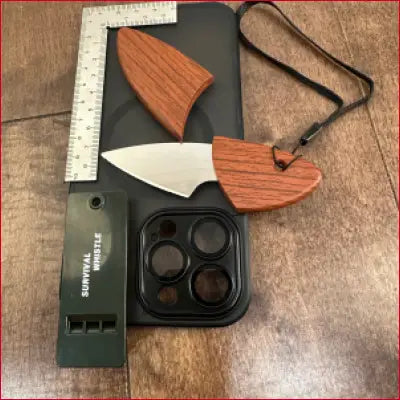 Survival knife with wooden handle and sheath in iPhone 14 Black Case with Box Opener and Frame Ruler