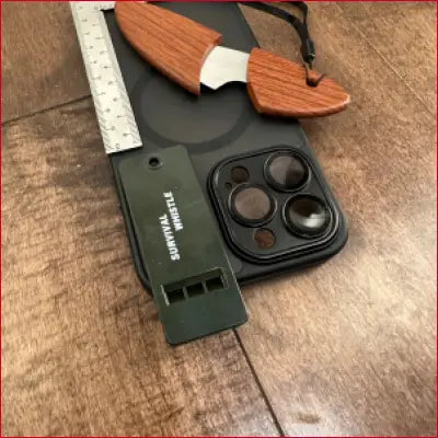 Survival-themed iPhone 14 black case with box opener, frame ruler, and whistle