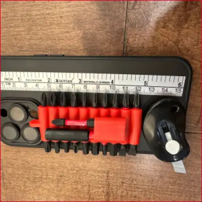 Multi-tool phone case with black case, box cutter, and screwdriver bits for iPhone 14 Plus