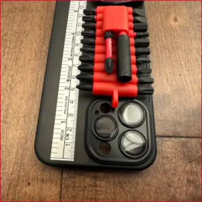 Black phone case with screwdriver bits and box cutter for iPhone 14 Plus Black Case