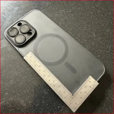 Black iPhone 14 Pro Max with stainless frame and camera lenses, showcasing frame ruler