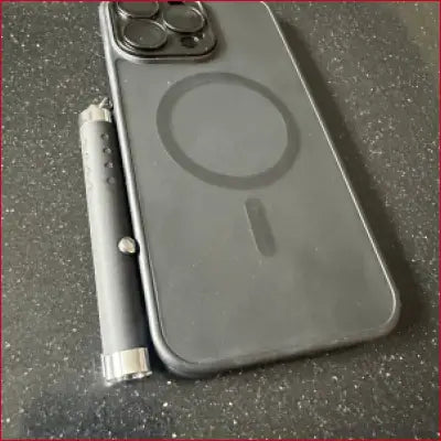 Black iPhone 15 case with laser pointer and crotch zipper design for sleek protection