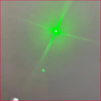 Bright green laser beam from iPhone 15 Black Case Laser Pointer with crotch zipper