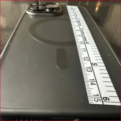 Gray smartphone with measuring tape showcasing iPhone 15 Pro Black Case Silver Ruler