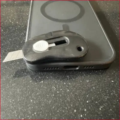 Pro Max black phone case with box cutter and utility knife for iPhone 15 Pro Max