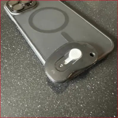 Smartphone with magnetic attachment in iPhone 15 Pro Max Black Case Box Cutter