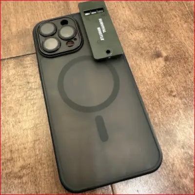 Black iPhone 16 Plus case with attached survival whistle for outdoor protection