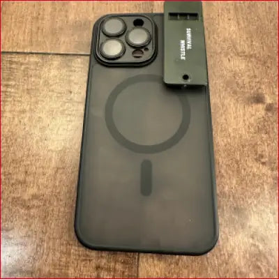 Black iPhone 16 Plus case with built-in survival whistle for outdoor safety