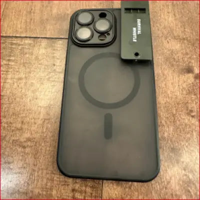 Gray iPhone 16 Plus Black Case with Survival Whistle for added protection