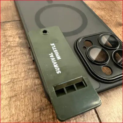 Olive green survival whistle attached to iPhone 16 Plus Black Case for outdoor safety