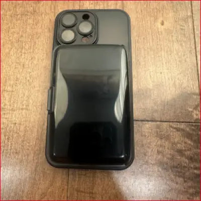 Black case for iPhone 16 Pro Max with built-in card holder and battery pack