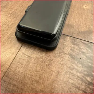 Black case for iPhone 16 Pro Max with card holder protection