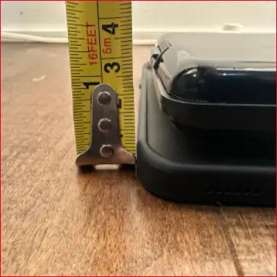 Black case for iPhone 16 Pro Max with card holder and tape measure