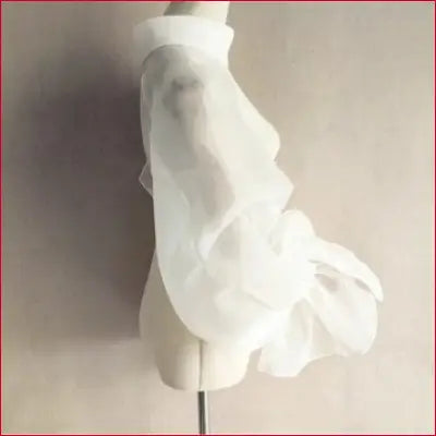 Sheer white organza wedding shrug with puffy trumpet sleeves, perfect for bridal looks