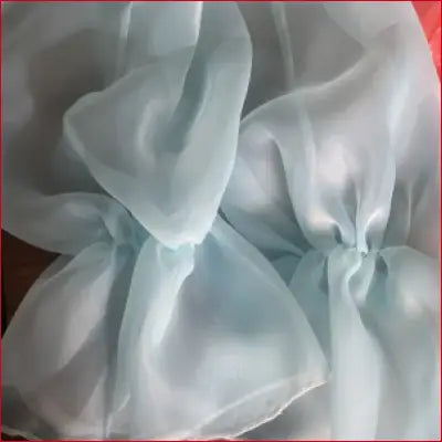 Light blue sheer fabric for organza wedding shrug with puffy full trumpet sleeves