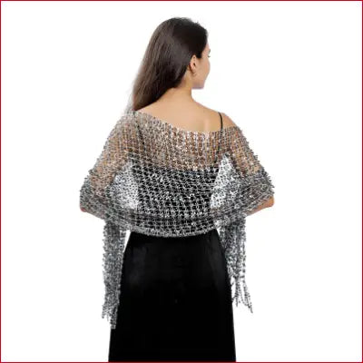 Woman wearing a silver mesh shawl from 1920s scarf wraps collection for vintage evening events