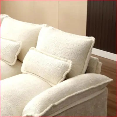 Creamy textured sectional sofa couch with plush pillows in modern chenille U shaped design