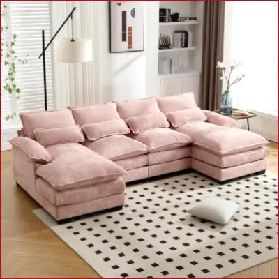 Pink sectional sofa couch with plush cushions in a modern chenille U shaped design