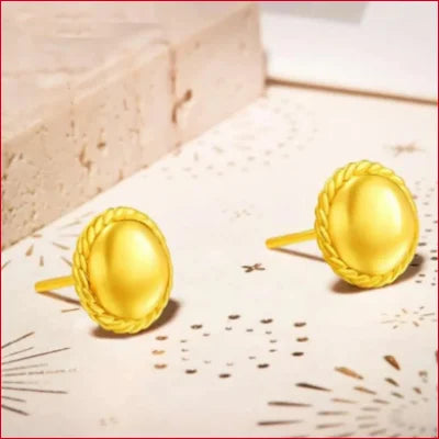 Pair of fine round stud earrings in pure 24k gold with braided edges