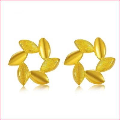 Two circular arrangements of yellow pills with 24K Gold Stud Earrings displayed