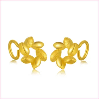 Gold stud earrings featuring floral shapes and leaf designs in 24k gold