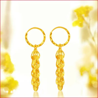 Gold hoop drop earrings featuring leaf-shaped designs in pure solid 24k gold