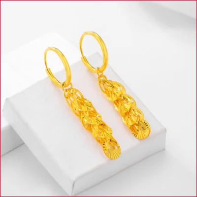 Gold hoop drop earrings featuring intricate floral designs in 24k pure solid gold