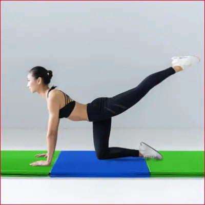 Woman in workout attire doing leg lift on a gym mat for home exercise and yoga