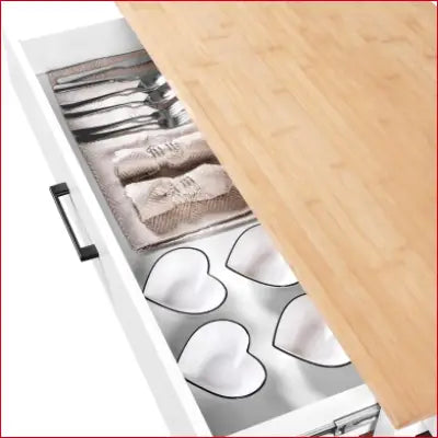 Open drawer of a 40 Width Kitchen Island Cart showcasing elegant tableware