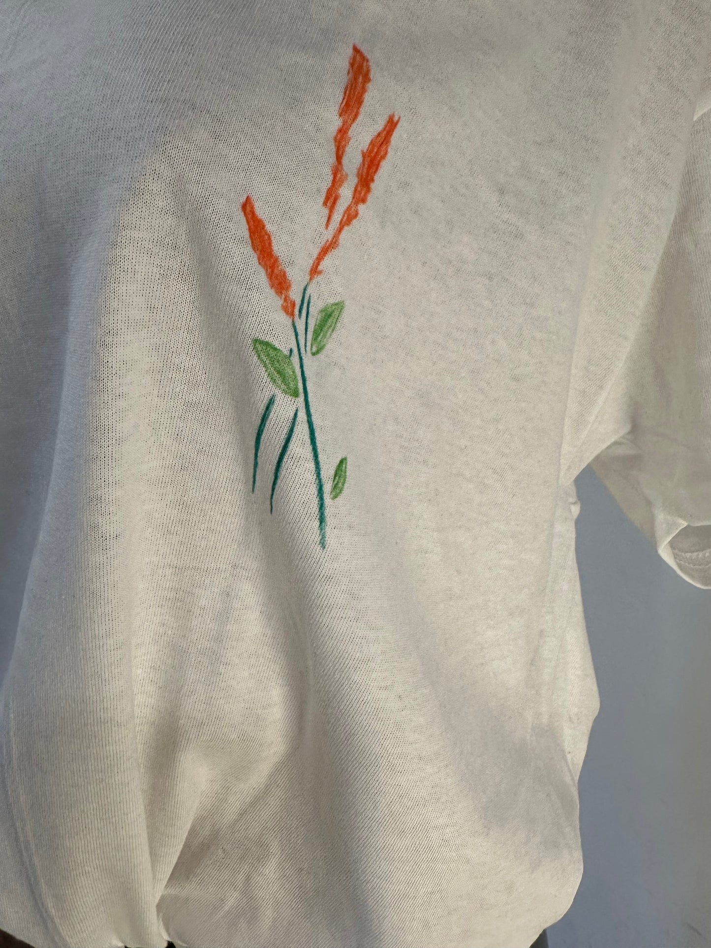 Handmade white v-neck cotton T-shirt with orange flower and leaves drawing design