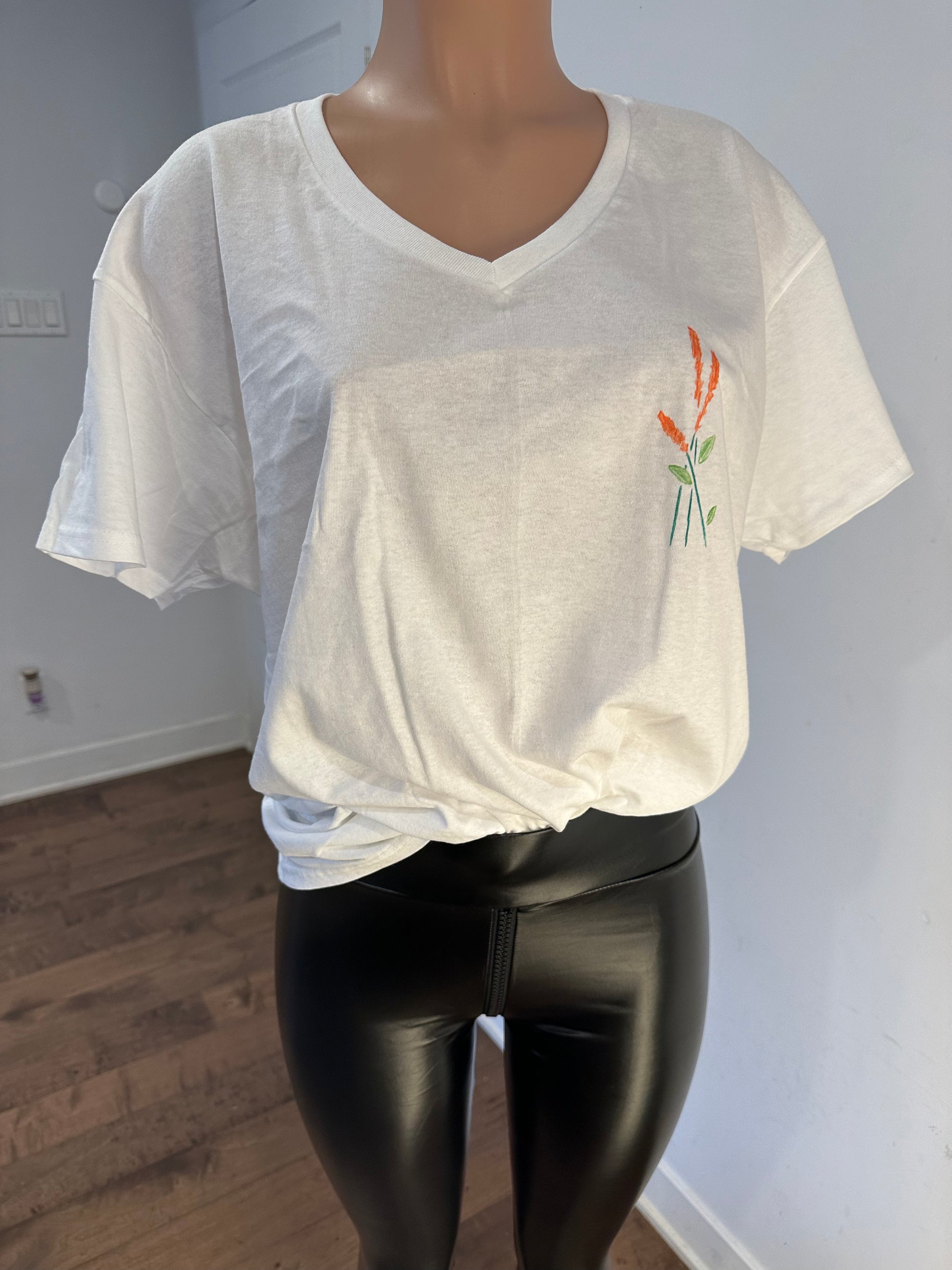 Handmade white v-neck cotton women’s t-shirt with leaves drawing on the chest