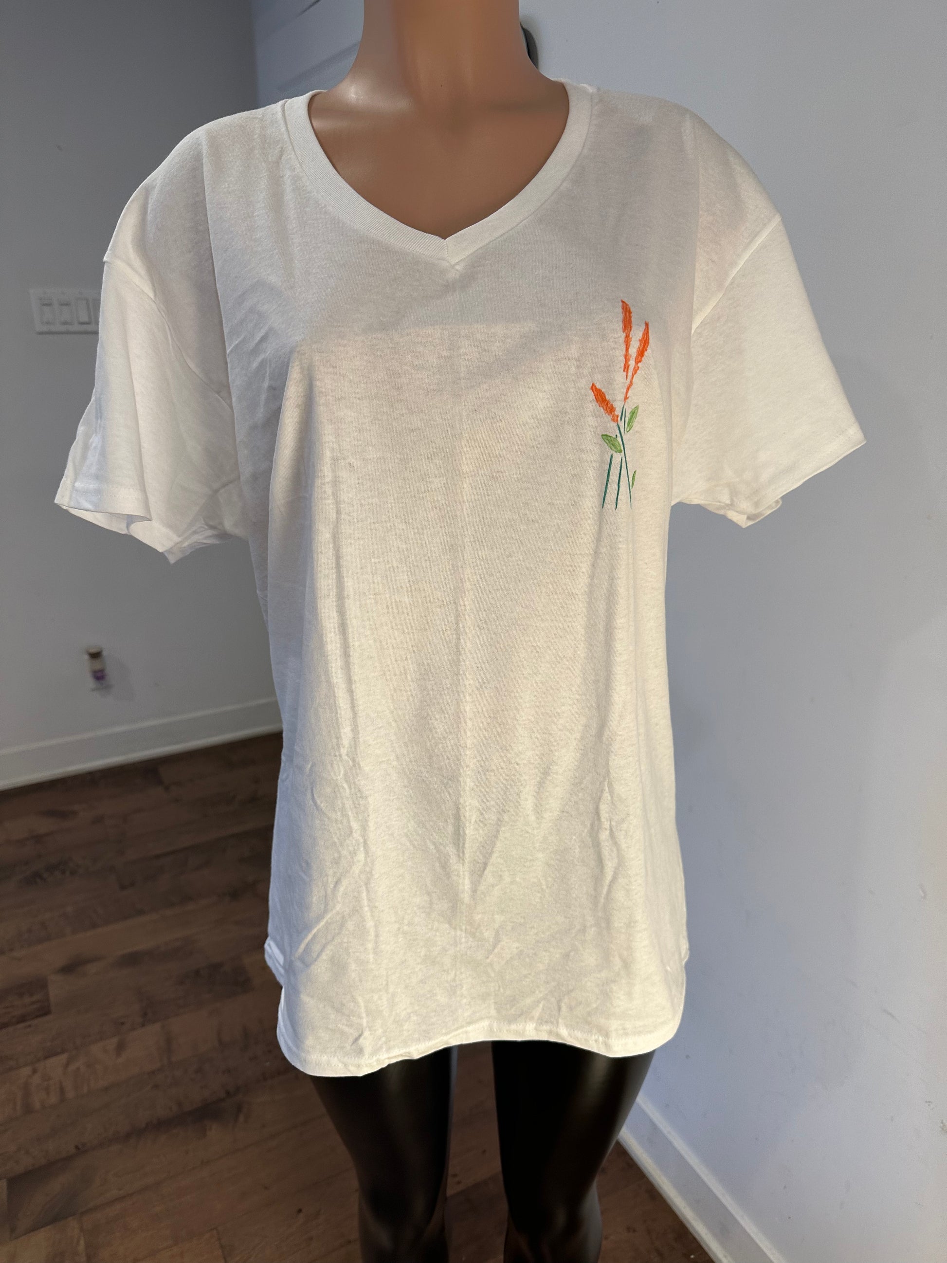 Handmade white v-neck t-shirt with leaves drawing floral design on chest