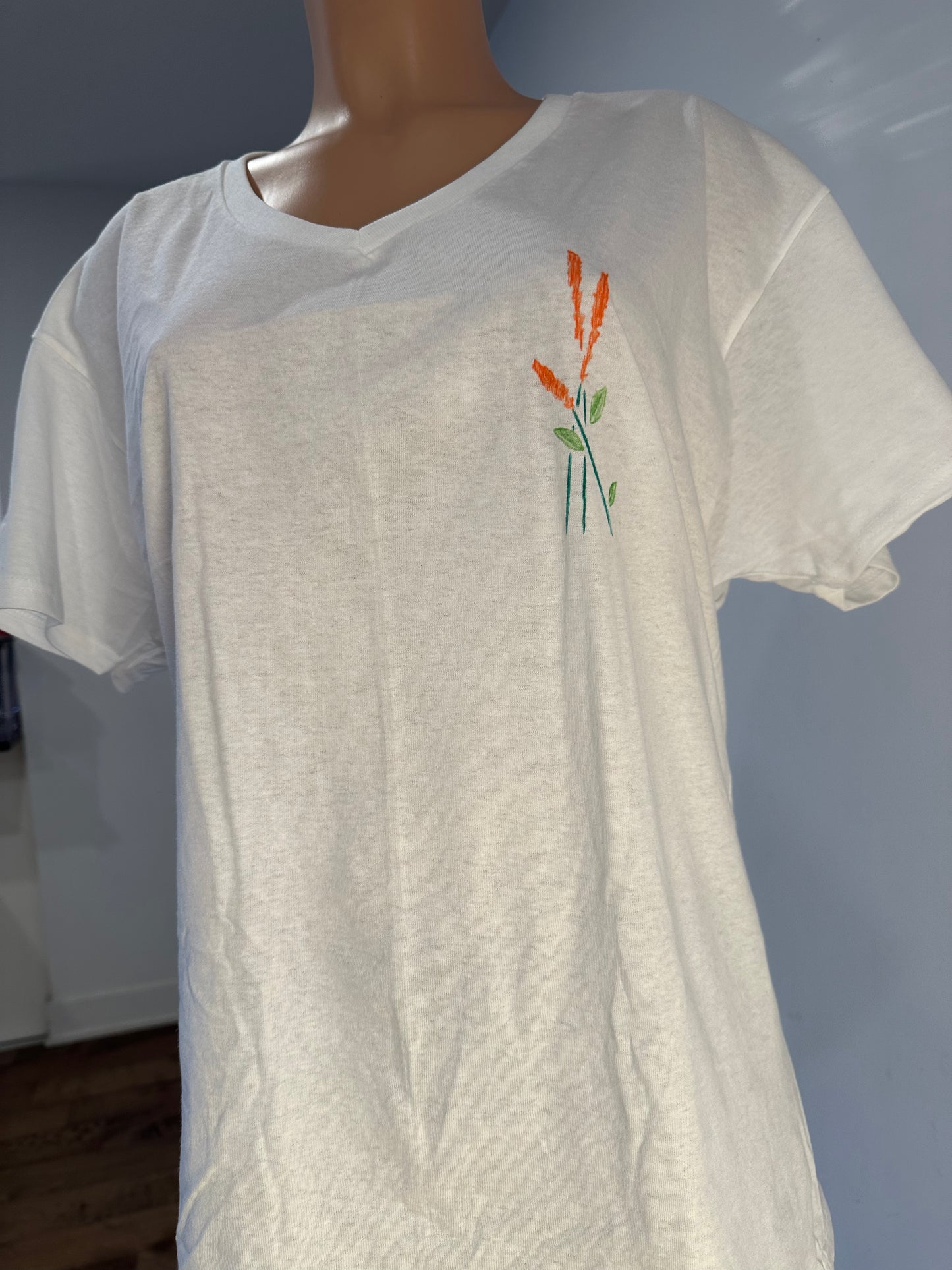 Handmade white v-neck cotton women’s t-shirt with floral leaves drawing embroidery