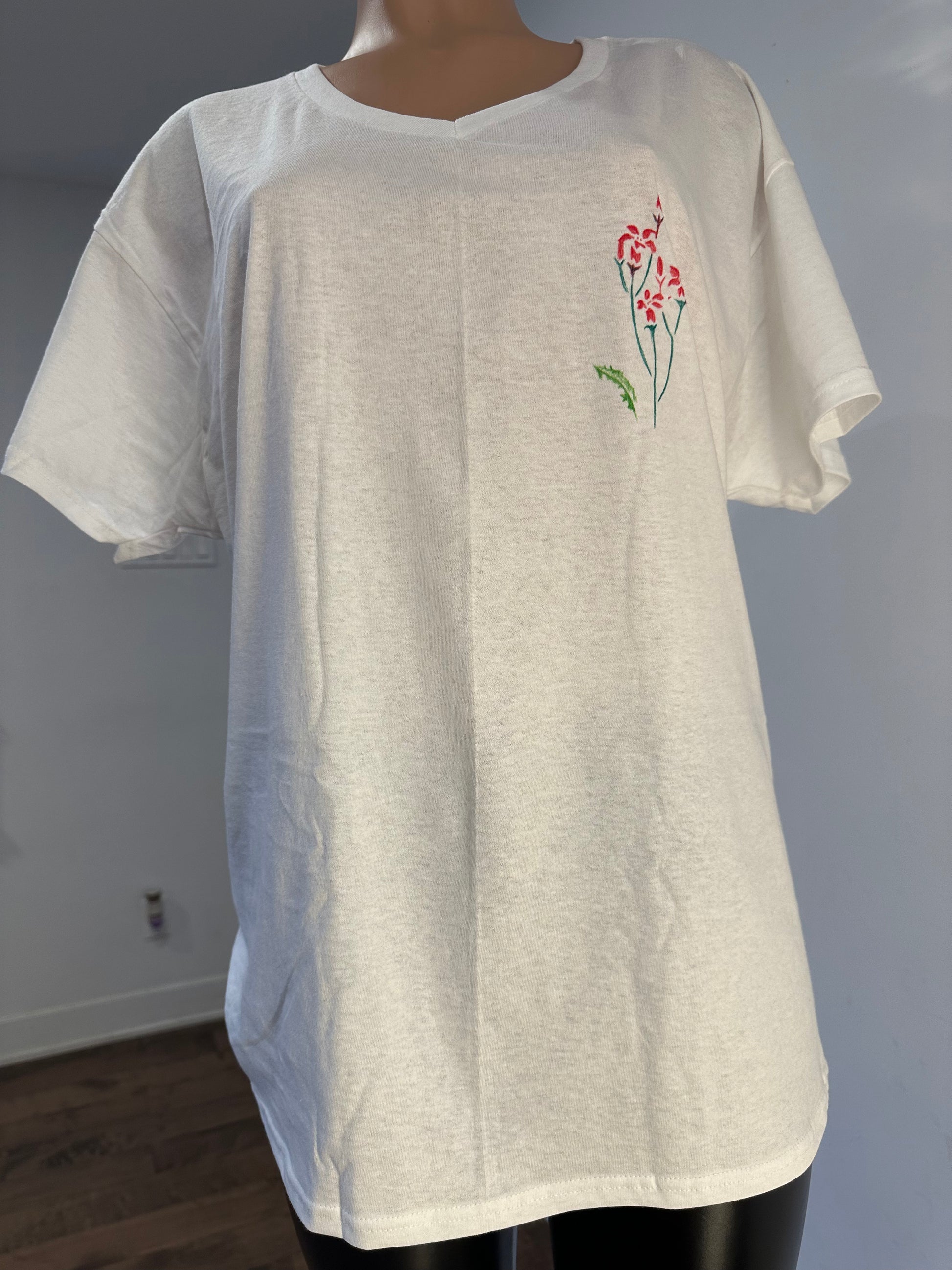 Handmade white V-neck cotton t-shirt featuring floral embroidery and palm tree drawing