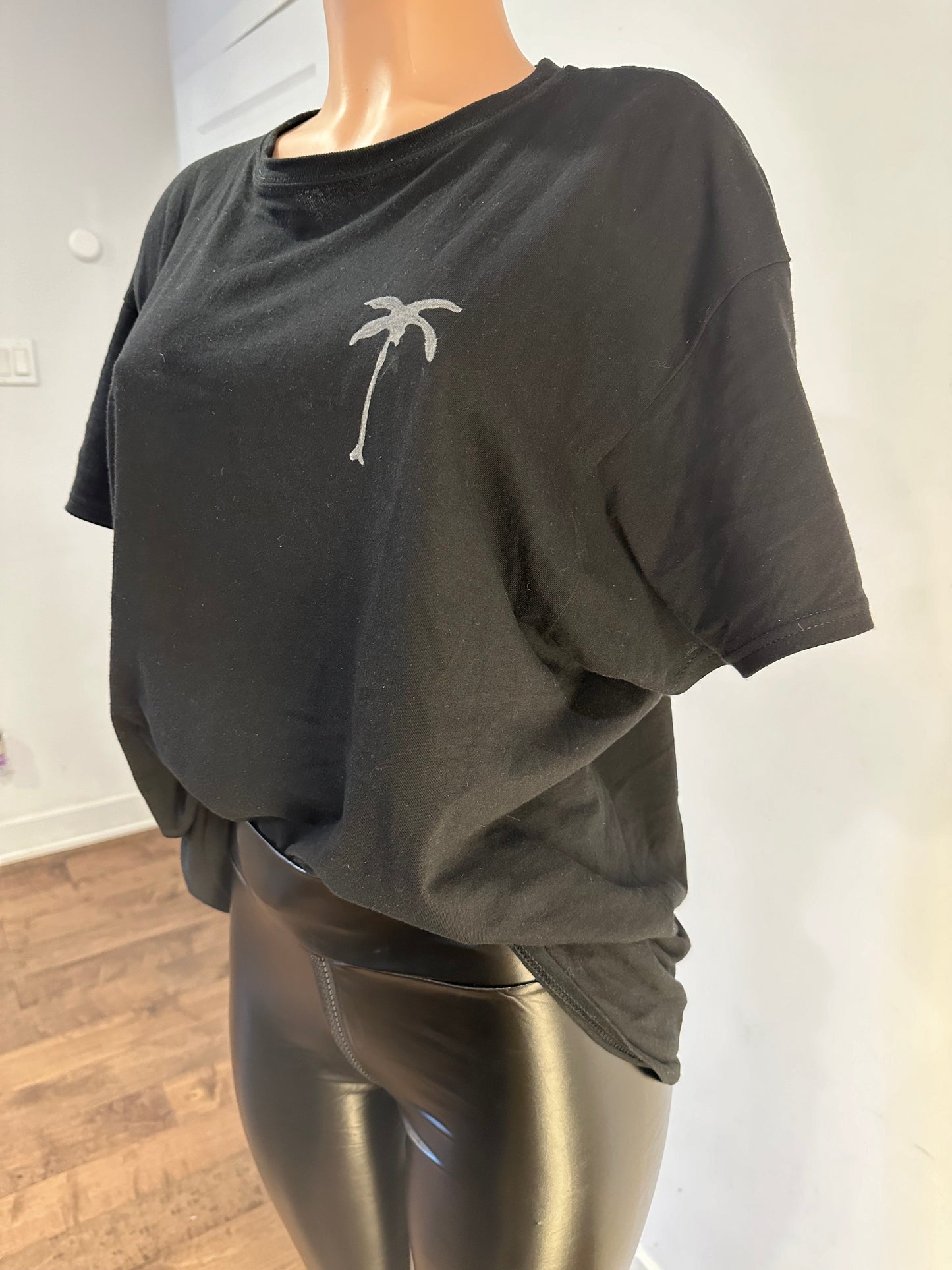 Handmade black crew neck men’s t-shirt featuring a palm tree drawing on the chest