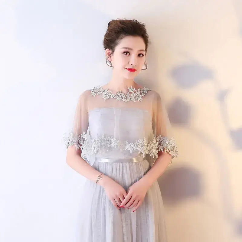 Elegant gray lace-trimmed bridal evening dress with shawl and pearl cape accessory