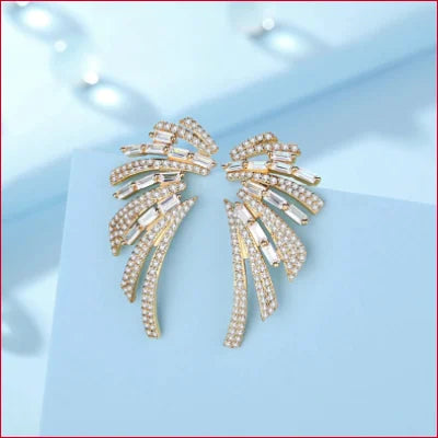 Unique Angel Wings Drop Earrings featuring ornate gold and diamond wing design