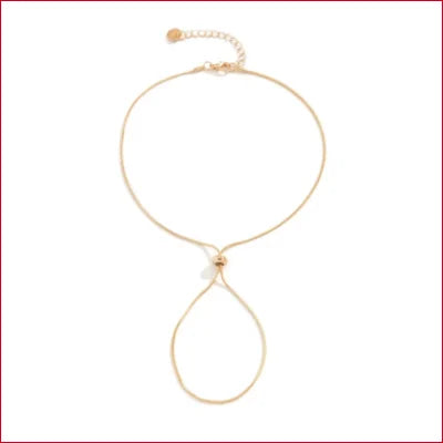 Delicate gold-toned necklace with teardrop pendant perfect for heels foot jewelry