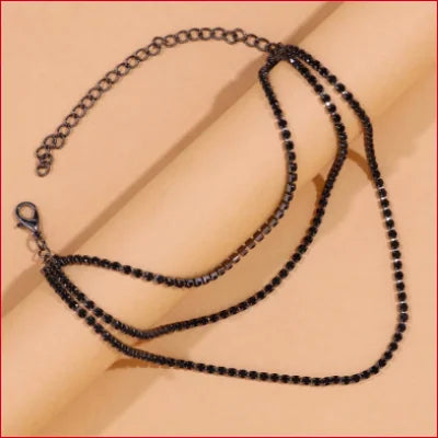 Black beaded necklace with multiple strands for stylish ankle bracelet or wedding dress accessory