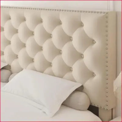 Tufted cream-colored headboard with nailhead trim for Modern Upholstered Platform Bed