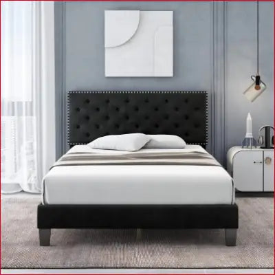 Black upholstered platform bed with adjustable headboard and tufted design for modern style