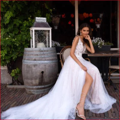 Elegant V-Neck Wedding Dress in White with High Slit and Flowing Train for Bohemian Style