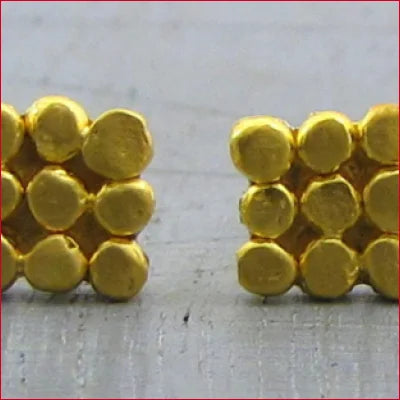 Yellow Lego bricks in flower shapes complemented by Pure Solid 24k Gold Stud earrings